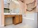 Bathroom with vanity, bathtub, and wall decor at 12322 Hawkeye Point Pl, Riverview, FL 33578