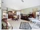 Spacious dining area showcasing a classic dining set, china cabinet, and contemporary decor at 12322 Hawkeye Point Pl, Riverview, FL 33578