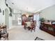 Charming dining area with a classic dining set, china cabinet, and view into the living spaces at 12322 Hawkeye Point Pl, Riverview, FL 33578