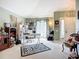 Versatile living space with natural light, a cozy chair, and an inviting atmosphere for relaxation or work at 12322 Hawkeye Point Pl, Riverview, FL 33578
