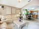 Open-concept design showcases the living room and dining area, creating an airy and connected living space at 12322 Hawkeye Point Pl, Riverview, FL 33578