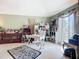 Bright office area features a white desk, ample shelving, and a zebra rug adding personality to the space at 12322 Hawkeye Point Pl, Riverview, FL 33578