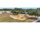 Community playground with swings, slides and climbing areas, perfect for families at 12322 Hawkeye Point Pl, Riverview, FL 33578