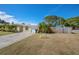 Charming home with a front yard and an ample driveway leading to the garage at 12384 144Th St, Largo, FL 33774