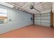 Clean, spacious garage interior with an operational door and block walls, providing secure parking at 12384 144Th St, Largo, FL 33774