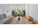 Living room featuring wood floors, natural light and comfortable furniture at 12384 144Th St, Largo, FL 33774