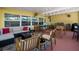 Large covered patio featuring a sectional sofa, multiple chairs and games for entertainment at 12384 144Th St, Largo, FL 33774