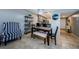 Dining room with a view of the kitchen and chair rail along the wall at 124 Nina Way # 24, Oldsmar, FL 34677