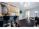 Dining Room featuring breakfast bar, gray cabinets, granite countertops, and stainless steel appliances at 124 Nina Way # 24, Oldsmar, FL 34677