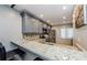 Modern kitchen with gray cabinets, granite countertops, and stainless steel appliances at 124 Nina Way # 24, Oldsmar, FL 34677