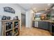 Open kitchen layout with gray cabinets and stainless steel appliances at 124 Nina Way # 24, Oldsmar, FL 34677