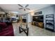 Open concept living room with tile floors. The living room seamlessly flows into the dining and kitchen areas at 124 Nina Way # 24, Oldsmar, FL 34677