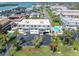 Scenic aerial view showcasing the complex, community pool, and nearby waterfront views at 12485 2Nd E St # C103, Treasure Island, FL 33706