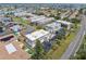 Overhead view of complex near ocean, showcasing pool and landscaping at 12485 2Nd E St # C103, Treasure Island, FL 33706