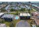 Aerial view highlighting complex with community pool and landscaping at 12485 2Nd E St # C103, Treasure Island, FL 33706