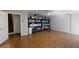 Finished basement with tiled floor, storage shelves, and an open staircase to the floor above at 12485 2Nd E St # C103, Treasure Island, FL 33706