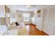 Bedroom featuring hardwood floors, white walls and trim, and a single window at 12485 2Nd E St # C103, Treasure Island, FL 33706