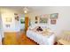 Bedroom features hardwood floors, white walls and trim, and a daybed at 12485 2Nd E St # C103, Treasure Island, FL 33706