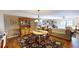 Open concept dining room with wood floors and traditional furnishings at 12485 2Nd E St # C103, Treasure Island, FL 33706