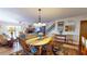 Bright dining room with hardwood floors, adjacent to the living room at 12485 2Nd E St # C103, Treasure Island, FL 33706
