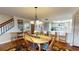 Open dining area shows stairs and the kitchen in the background at 12485 2Nd E St # C103, Treasure Island, FL 33706