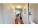Inviting hallway leading to a spacious living area with hardwood floors at 12485 2Nd E St # C103, Treasure Island, FL 33706