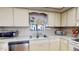 Bright kitchen with stainless steel appliances and a double sink at 12485 2Nd E St # C103, Treasure Island, FL 33706