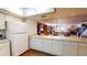 Open kitchen boasts generous counter space, perfect for entertaining at 12485 2Nd E St # C103, Treasure Island, FL 33706