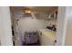 Laundry room includes washer, dryer, water heater and shelving, as well as a storage rack at 12485 2Nd E St # C103, Treasure Island, FL 33706