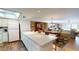 Spacious open-concept living and dining area with hardwood floors and skylight at 12485 2Nd E St # C103, Treasure Island, FL 33706