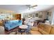 Spacious living room featuring hard floors that leads to the kitchen and dining room at 12485 2Nd E St # C103, Treasure Island, FL 33706