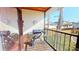 Screened patio with tiled floor, a grill, and a view of the surrounding neighborhood at 12485 2Nd E St # C103, Treasure Island, FL 33706