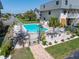 Community pool with lounge chairs and meticulously maintained landscaping providing a serene outdoor retreat at 12485 2Nd E St # C103, Treasure Island, FL 33706