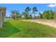Expansive backyard featuring lush green grass and mature trees, perfect for outdoor activities at 13193 Paxton Ave, Weeki Wachee, FL 34614