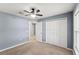 Bedroom with carpet, fan and closet leading to other rooms at 13193 Paxton Ave, Weeki Wachee, FL 34614