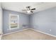Cozy bedroom featuring a ceiling fan and natural light from a window at 13193 Paxton Ave, Weeki Wachee, FL 34614