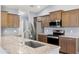 Close up of the kitchen showing stainless steel appliances and granite countertops at 13193 Paxton Ave, Weeki Wachee, FL 34614