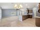 Open-concept kitchen features wood cabinets, stainless steel appliances and granite countertops at 13193 Paxton Ave, Weeki Wachee, FL 34614