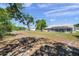Spacious backyard with screened-in pool and plenty of room for outdoor activities and relaxation at 13290 Don Loop, Spring Hill, FL 34609