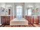 Bright bathroom with dual vanity sinks, a soaking tub, and tile flooring at 13290 Don Loop, Spring Hill, FL 34609
