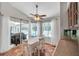 Bright breakfast nook with tile floors and sliding doors to the lanai and pool at 13290 Don Loop, Spring Hill, FL 34609