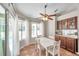 Bright breakfast nook with access to the lanai and pool with a built in buffet at 13290 Don Loop, Spring Hill, FL 34609