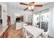 Breakfast nook with white table and chairs adjacent to open kitchen and sliding doors at 13290 Don Loop, Spring Hill, FL 34609