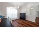 Dining room with a large window, modern lighting, and wood-look flooring at 13290 Don Loop, Spring Hill, FL 34609