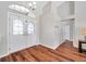 Bright foyer with arched glass double doors, chandelier and beautiful wood-look flooring at 13290 Don Loop, Spring Hill, FL 34609