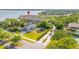 Aerial view of the condo near a stunning waterfront with lush trees and luxury home at 140 Brent Cir, Oldsmar, FL 34677