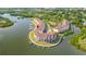 Aerial view of waterfront condos, featuring boat slips, convenient parking, and a community pool at 140 Brent Cir, Oldsmar, FL 34677