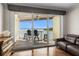 Covered balcony with chairs and table overlooking the waterfront and a water view at 140 Brent Cir, Oldsmar, FL 34677