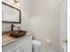 Charming powder room with granite countertops and a modern vessel sink at 140 Brent Cir, Oldsmar, FL 34677
