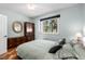 Cozy bedroom with wood floors, ample natural light, and classic furniture pieces at 140 Brent Cir, Oldsmar, FL 34677
